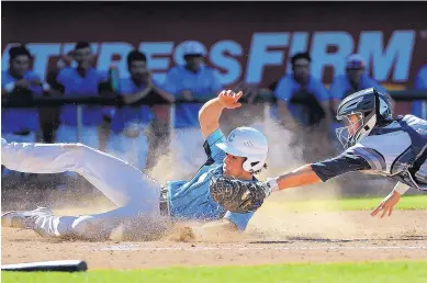  ?? JIM THOMPSON/JOURNAL ?? Cleveland’s Giacomo Musante slides past Piedra Vista catcher Andrew Caliendo for a run Friday at Isotopes Park during the Storm’s 10-2 win in the Class 6A semifinals.