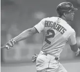  ?? CHRIS O’MEARA/AP ?? The Red Sox’s Xander Bogaerts watches his RBI single off Rays starting pitcher Ryan Yarbrough during the first inning Tuesday in St. Petersburg, Fla. Boston’s J.D. Martinez scored on the hit.