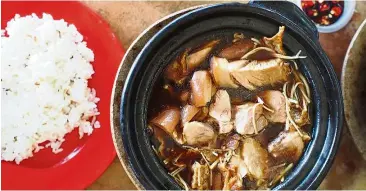  ??  ?? A pot of claypot bak kut teh with mixed cuts served with xian fan at Yap Eng in Taman Sentosa, Klang.