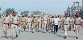  ?? HT PHOTO ?? Police personnel taking out a march in Phagwara after a clash between Dalit and rightwing Hindu groups, on Saturday.