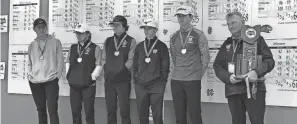  ?? DAVE WEIDIG/THE ADVOCATE ?? Newark Catholic poses with the Division III state runner-up trophy Oct. 14 at Ohio State’s Scarlet Course. Pictured, from left, are Max Vanoy, Brian Luft, Brogan Sullivan, Bobby Kieber, Nathan Riggleman and coach Phil West.