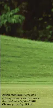  ??  ?? Justin Thomas reacts after missing a putt on the 6th hole in the third round of the CIMB Classic yesterday. AFP pic