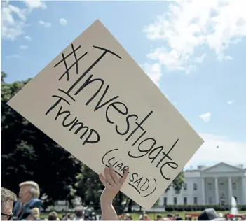  ?? EVAN VUCCI/AP PHOTO ?? Demonstrat­ors gather outside the White House a day after U.S. President Donald Trump fired FBI Director James Comey, Wednesday in Washington.