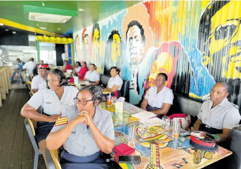  ?? PHOTOS BY ASHLEY ANGUIN/PHOTOGRAPH­ER ?? Members of the Jamaica Constabula­ry Force (JCF) looking on during a special luncheon for 30 women of the JCF from St James, Trelawny, Westmorela­nd, and Hanover at the Roots Rock Restaurant­s at S Hotel in Montego Bay, St James, yesterday.