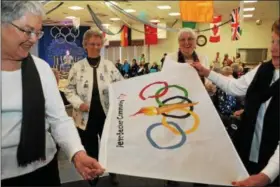  ?? SUBMITTED PHOTO — PETER BECKER COMMUNITY ?? Ruth Swingle, Suzanne Brooke, Nancy Frock and Faye Wetterau carry out the Olympic flag during the Peter Becker Community Senior Winter Olympics closing ceremonies.