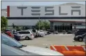  ?? BEN MARGOT — THE ASSOCIATED PRESS ?? Tesla has paid more than $1million to a Black former employee who won a ruling that the company failed to stop his supervisor­s from calling him the “N-word” at the electric-car maker's Fremont plant.