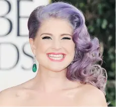  ?? THE ASSOCIATED PRESS/FILES ?? Kelly Osbourne has done a great job in making unconventi­onal hair colours such as ultra violet look sophistica­ted and natural, says Kara Gilbertson, co-owner of the Attic Hair Studio.