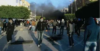  ?? AFP/GETTY IMAGES FILE PHOTO ?? Protesters clash with security forces in Sidi Bouzid, Tunisia, in 2010 at the outset of the Arab Spring movement.