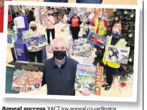  ??  ?? Appeal success XACT toy appeal co-ordinator Norbert Grant with staff at Tesco in Airdrie