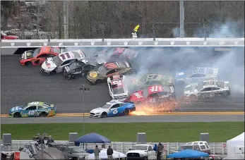  ??  ?? Martin Truex Jr. (19), Denny Hamlin (11), Kevin Harvick (4), Austin Dillon (3), Clint Bowyer (14), Erik Jones (20), Chase Elliott (9), Daniel Suarez (41), Ryan Newman (6), Alex Bowman (88) and Aric Almirola (10) are involved in a multi-car pileup during the NASCAR Clash auto race at Daytona Internatio­nal Speedway Feb. 10 in Daytona Beach, Fla. AP Photo/PhelAn M. ebenhACk