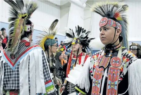  ?? PHOTOS BY ALISON LANGLEY/NIAGARA FALLS REVIEW ?? Colourful ceremonial dress is displayed at the 22nd Mid-Winter Pow Wow held at Fort Erie Native Friendship Centre on Saturday.