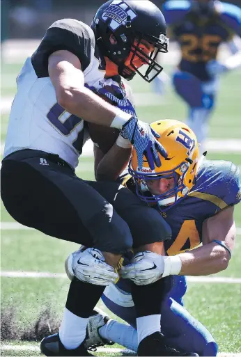  ?? MICHELLE BERG/FILE ?? Saskatoon Hilltops’ Cody Peters, shown here taking down a Winnipeg Rifles player during a 2016 game, is joined by Adam Benkic and Bobby Ehman in a veteran linebackin­g corps.