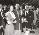  ??  ?? Ben Hogan convalesce­s in 1949 [left], and just 14 months later he was U.S. Open champion at Merion [above, pictured with his wife Valerie and the USGA’s James D. Standish, Jr.]