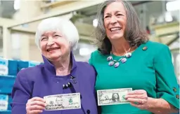  ?? LM OTERO/AP ?? Treasury Secretary Janet Yellen, left, and U.S. Treasurer Lynn Malerba hold money they autographe­d Thursday in Fort Worth, Texas.