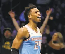  ?? Streeter Lecka / Getty Images ?? Sacramento’s Buddy Hield took part in the 3-point shooting contest Saturday. He and De’Aaron Fox boost the Kings.