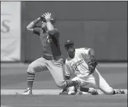  ?? NWA Democrat-Gazette/BEN GOFF • @NWABENGOFF ?? John Nogowski (left), Springfiel­d first baseman, reacts after being called out at second on a tag by Carlos Diaz, Northwest Arkansas second baseman, in the sixth inning Sunday during the game at Arvest Ballpark in Springdale.