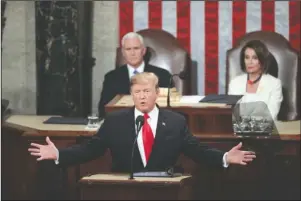  ?? The Associated Press ?? TIME OF TURMOIL: In this Feb. 5, 2019, file photo, President Donald Trump delivers his State of the Union address to a joint session of Congress on Capitol Hill in Washington, as Vice President Mike Pence and Speaker of the House Nancy Pelosi, D-Calif., watch. Two decades ago, President Bill Clinton delivered his State of the Union address before a nation transfixed by his impeachmen­t. He didn’t use the I-word once. President Donald Trump is far from the first president to deliver a State of the Union address in a time of turmoil.