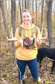  ?? Photo by Bethany Ford ?? Ford holds a set of whitetail sheds in the woods. It’s always a perk when you get the matching set.