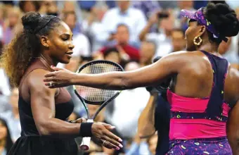  ??  ?? Serena greets her sister Venus after the third round match Photo: AP