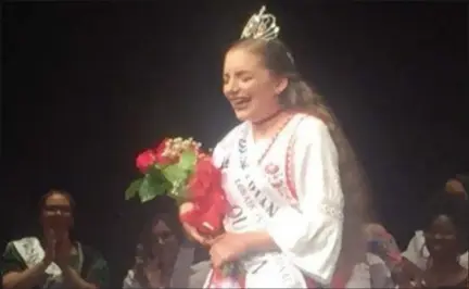  ?? KEVIN MARTIN — THE MORNING JOURNAL ?? Hungarian Princess Emily Hetrick reacts with emotion as she is named the 2018 Lorain Internatio­nal Queen on June 21.