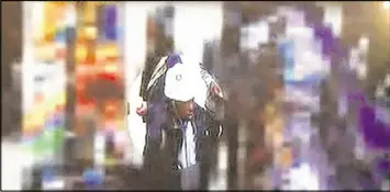  ?? ATLANTA POLICE VIDEO SNAPSHOT VIA CHANNEL 2 ACTION NEWS ?? The man pictured is a person of interest in the deadly shooting of a woman at Undergroun­d Atlanta on Tuesday.