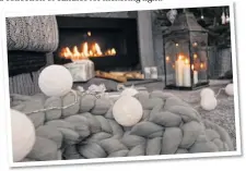  ??  ?? Chunky wool throws, a string of lights and a selection of lanterns, all below, conjure a look that says ‘stay in and snuggle’