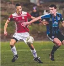  ?? ?? Launceston City’s Gediminas Krusa, clashes with Kingboroug­h’s Noah Mies. Picture: Anthony Corke