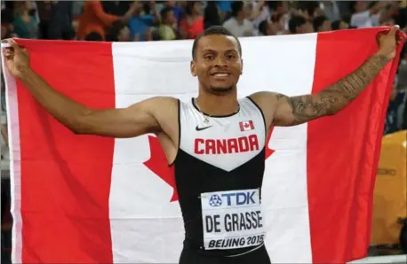  ?? LEE JIN-MAN, THE ASSOCIATED PRESS ?? Canada’s Andre De Grasse celebrates his bronze medal in the men’s 100m at the World Athletics Championsh­ips in Beijing in 2015.