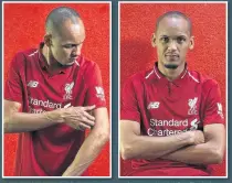  ??  ?? PERFECT FIT Fabinho puts on a Liverpool shirt for first time