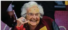  ?? AP/MATT MARTON ?? Sister Jean Dolores Schmidt poses for a picture with the Final Four ring she was given Tuesday night before Loyola-Chicago’s rematch against NCAA Tournament opponent Nevada.