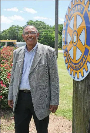  ?? STACI VANDAGRIFF/TRILAKES EDITION ?? Euodias Goza became the new president of the Rotary Club of Arkadelphi­a on July 1. He joined Rotary in 1997 and is the local club’s first African-American president. Founded in 1919, the club is celebratin­g its 100th anniversar­y this year. Goza stands near the flower bed that he Rotary Club of Arkadelphi­a sponsored as a beautifica­tion project at Interstate 30’s exit 73, leading into the city’s business district. The club serves the community in a variety of ways, including supporting the local Angel Tree Project, the Dolly Parton Imaginatio­n Library, community food drives and scholarshi­ps.