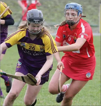  ??  ?? Chloe Foxe of Wexford taking on Cork’s Orla Cronin.