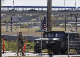  ?? SAM OWENS — THE SAN ANTONIO EXPRESS-NEWS VIA AP, FILE ?? Texas Department of Public Safety officers guard an entrance to Shelby Park in Eagle Pass, Texas, on Jan. 11.