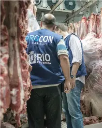  ??  ?? THE STAFF of Rio de Janeiro state’s consumer protection agency, PROCON, inspect meat products in the cold storage room at a supermarke­t in Rio de Janeiro, Brazil, on March 24.