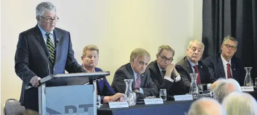  ?? PHOTO: GERARD O’BRIEN ?? Burning question . . . Pacific Edge chairman Chris Gallaher speaks at the company’s annual shareholde­rs meeting in Dunedin yesterday. Looking on (from left, sitting) chief executive David Darling and directors, David Levison, David Bland, Bryan Williams and Anatole Masfen.