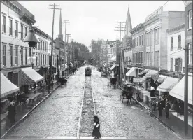  ?? PHOTO PROVIDED ?? This 1890s photo of Wall Street in Kingston, as seen from North Front Street, is part of an exhibit called “Uptown Kingston: Looking Back, Moving Forward.” Mayor Steve Noble posted the photo on his Facebook page this past weekend with the message “Wall Street without the Pike Plan. Very cool.”