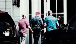  ?? BRENDAN SMIALOWSKI/GETTY-AFP ?? President Donald Trump, center, at Trump National Golf Club in Sterling, Va., on Sunday.