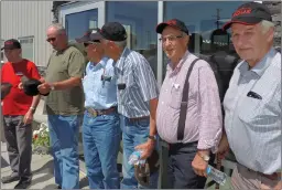  ?? Photo by Collin Gallant ?? Six former directors of Rural Electrific­ation Associatio­ns in the region line up for a photo at the the opening of the new EQUS REA shop, located south of Medicine Hat, on Monday. Pictured are (right to left) Evert Vanderberg, Walter Genesis, Jack...