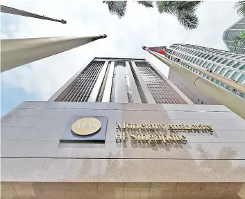  ?? — AFP photo ?? The Singaporea­n central bank said the licences have attracted strong interest from a diverse group of applicants that include e-commerce firms, technology and telecommun­ications companies, FinTechs and financial institutio­ns.