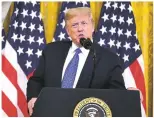  ?? PHOTOS BY EVAN VUCCI ASSOCIATED PRESS ?? Bernalillo County Sheriff Manuel Gonzales, right, waits Wednesday in the East Room of the White House for President Donald Trump’s announceme­nt on ‘Operation Legend,’ which will include deploying federal agents to Albuquerqu­e.