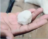  ?? FILE ?? A St Andrew man uses rice to make a ball. He believes that it is evidence that the rice is plastic.