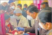  ?? HT ?? Chief justice Dr Ravi Ranjan administer­s polio drop to an infant at Deoghar Sadar Hospital.