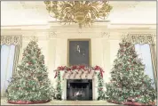  ?? EVAN VUCCI — THE ASSOCIATED PRESS ?? The State Dining Room of the White House is decorated for the holiday season during a press preview of the White House holiday decoration­s, Monday in Washington.