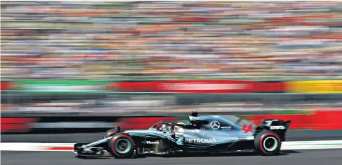  ??  ?? Man at the front: Lewis Hamilton sweeps around the circuit in Mexico City – he says Formula One will be ‘the best racing series ever’ if planned changes are a success