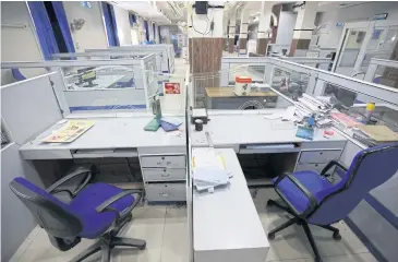  ??  ?? Bank counters are empty at one of the branches of the State Bank of India (SBI) in Amritsar yesterday.