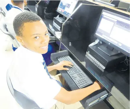  ??  ?? “It’s a great lab and far better than the first. I believe this is a significan­t gain to our school and will definitely aid in sharpening our computer literacy skills,” stated fourth form student Tyrese Lindsay.