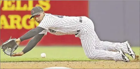  ?? USA TODAY SPORTS & GETTY ?? The Yanks’ signing of former Met Neil Walker —who had been staying in shape at free agent camp in Florida — doesn’t mean they’re not high on prospect Glyber Torres (above), but it’ll give Torres more time to get ready for big leagues.