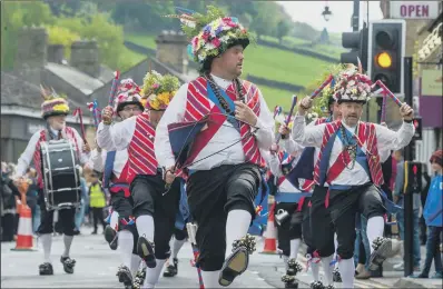  ?? PICTURE: JAMES HARDISTY ?? BELLS AND CLOGS:
A dance troupe entertains in Holmfirth. The festival ‘keeps folk music and dance and storytelli­ng alive’.