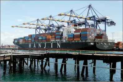  ?? AP/ REED SAXON ?? The container ship Hanjin Boston is unloaded at the Port of Los Angeles earlier this month. The A. P. Moeller- Maersk A/ S’ container line will try to purchase the struggling Hanjin line, analysts said Tuesday.