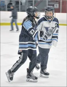  ?? SARA ERICSSON ?? Rylee Bennett, 13 and Brooke Alco, 12, take a spin around the rink.